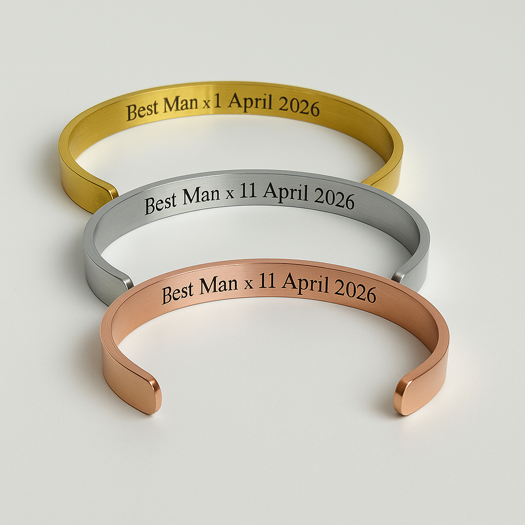 Three metallic bracelets with engraved text on a light gray background