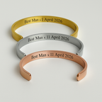 Three metallic bracelets with engraved text on a light gray background