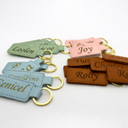 Example of laser engraved PU Leather keychains that have personalised names against different colour leather keychains